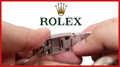 adjusting rolex watch jubilee strap.